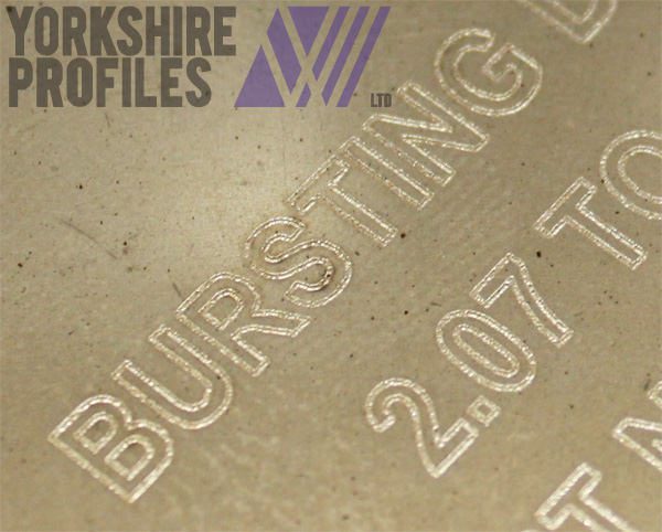 Laser etched part numbers in stainless steel.