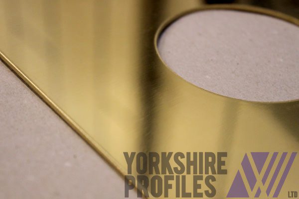 Brass parts which have been cut using a waterjet cutter