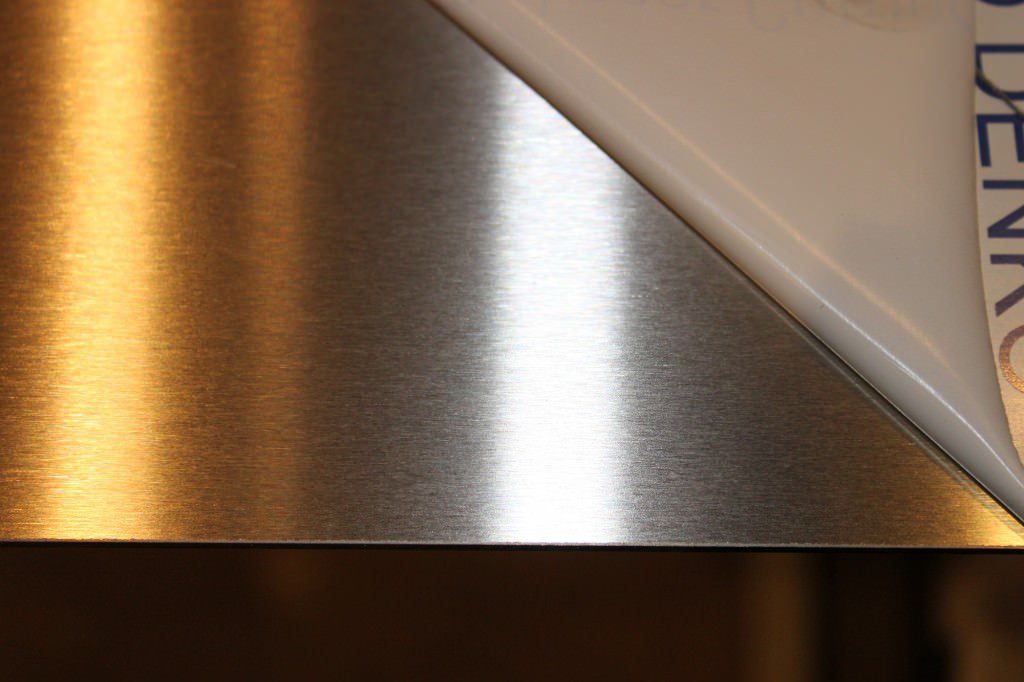 A dull polished stainless steel sheet with laser coating