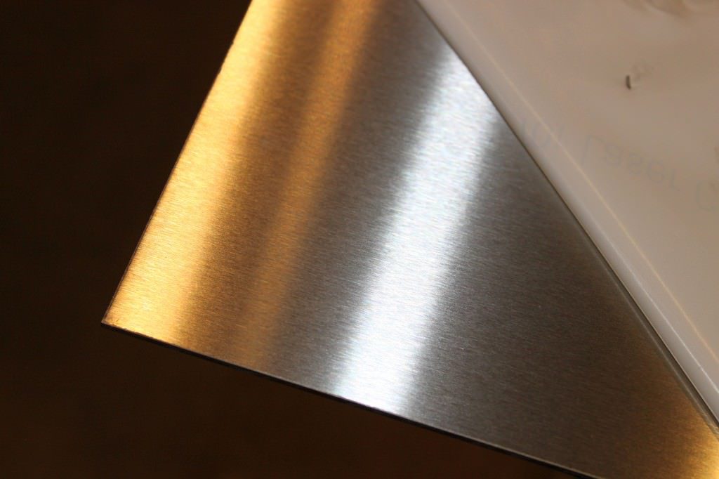 A satin polished stainless steel plate