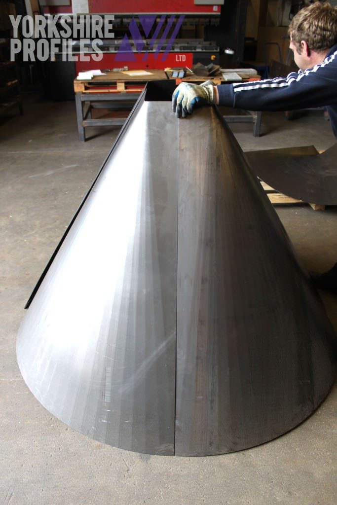 A sheet metal fabrication of a square to round cone
