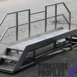 a stainless steel stairs fabrication with aluminium tread plate steps