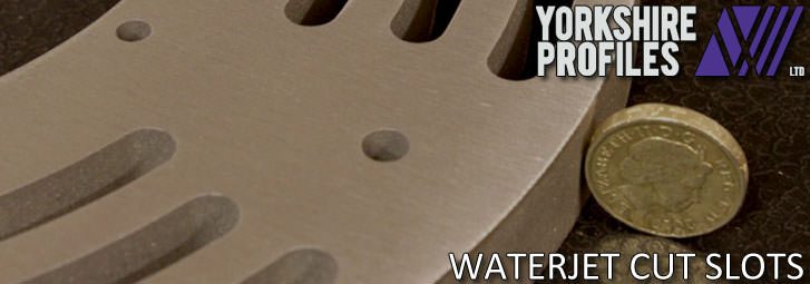 Slots waterjet cut into thick aluminium