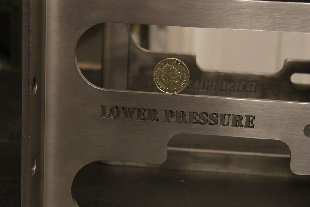 Small text laser cut in stainless steel folded bracket