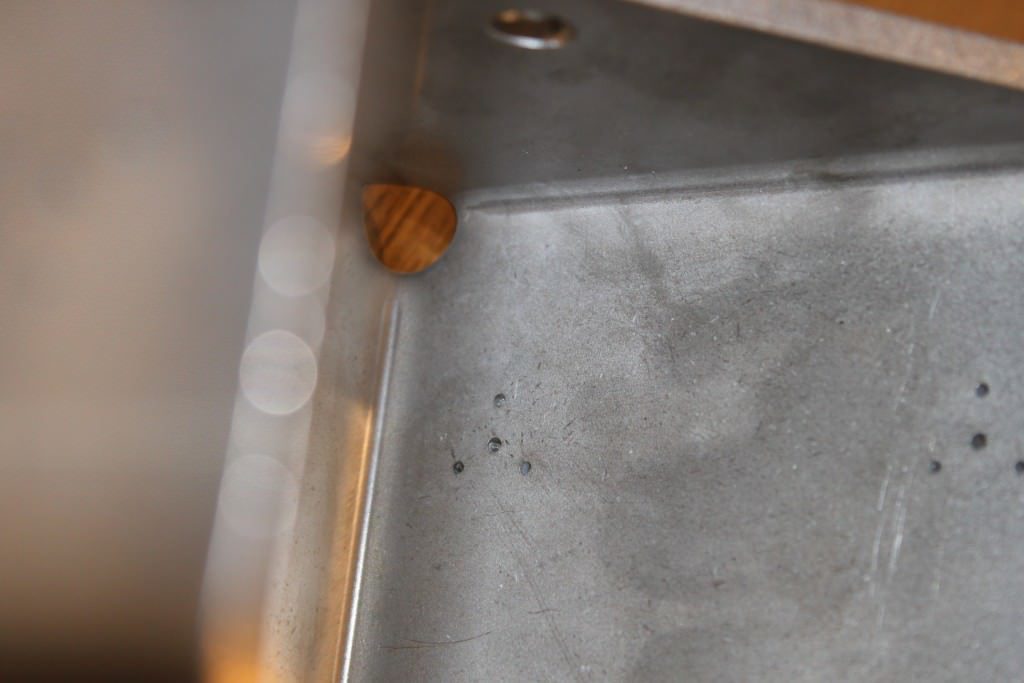 Small holes laser cut in 5mm thick stainless steel