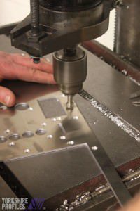 The countersinking of metal panels
