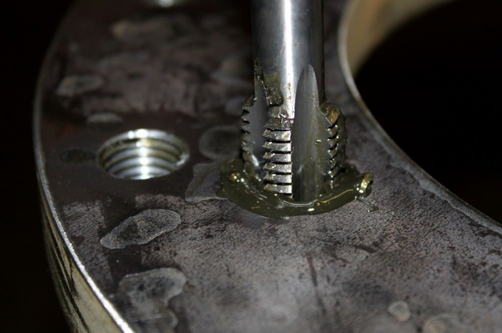Tapped holes in steel flanges
